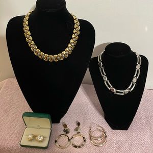 An assortment of vintage costume necklaces and earrings.